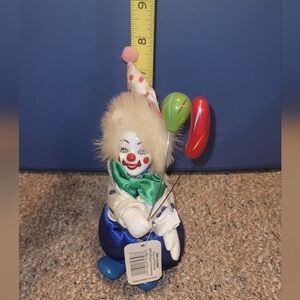 Vintage Clown Holding Balloons